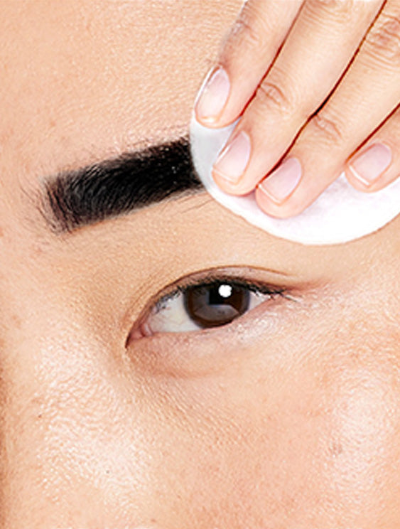 woman wiping natural black eyebrow tint from eyebrows