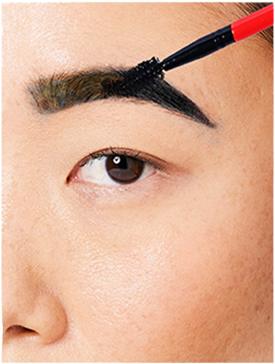 woman applying natural black eyebrow tint on eyebrows