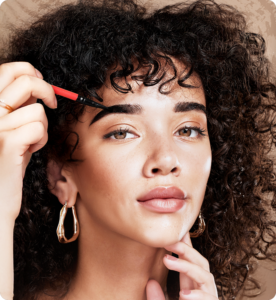 woman tinting her eyebrows dark brown