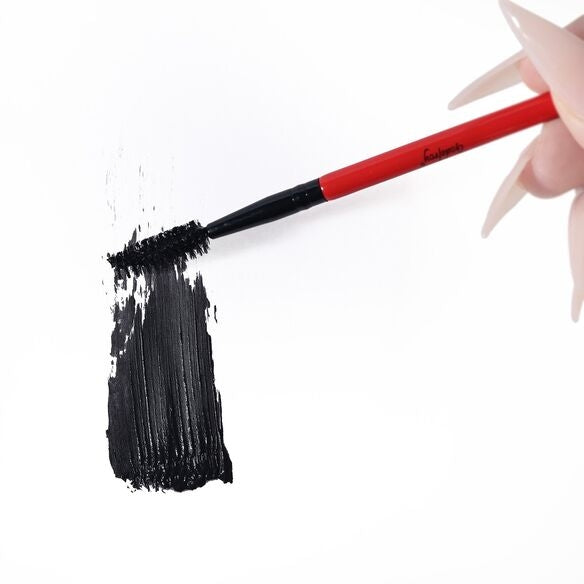 woman dragging eyebrow spoolie with tint