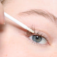 Load image into Gallery viewer, woman applying eyelash serum 
