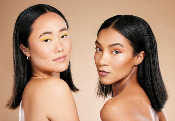2 editorial women with eyebrow slits