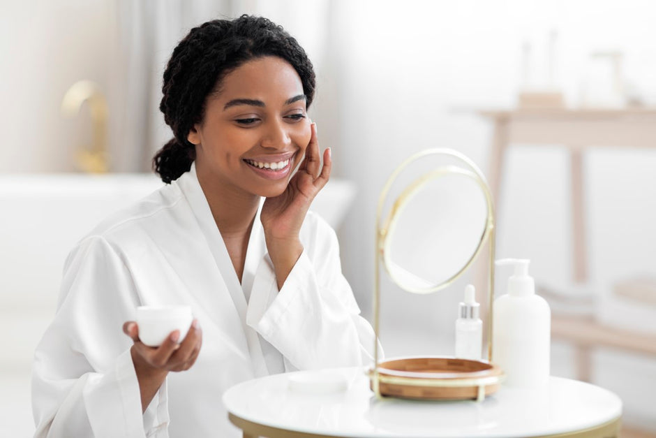 Beautiful woman applying skincare