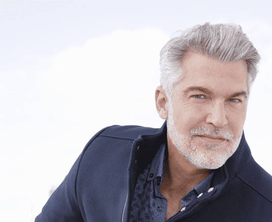 senior man with grey hair and facial hair