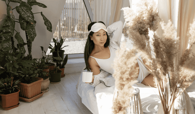 Woman in her room waking up