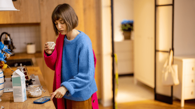 tired woman with short hair drinking coffee