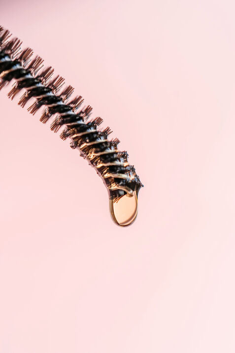 serum dripping from spoolie brush