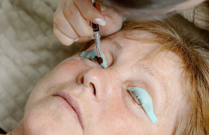 Woman getting her eyelashes tinted