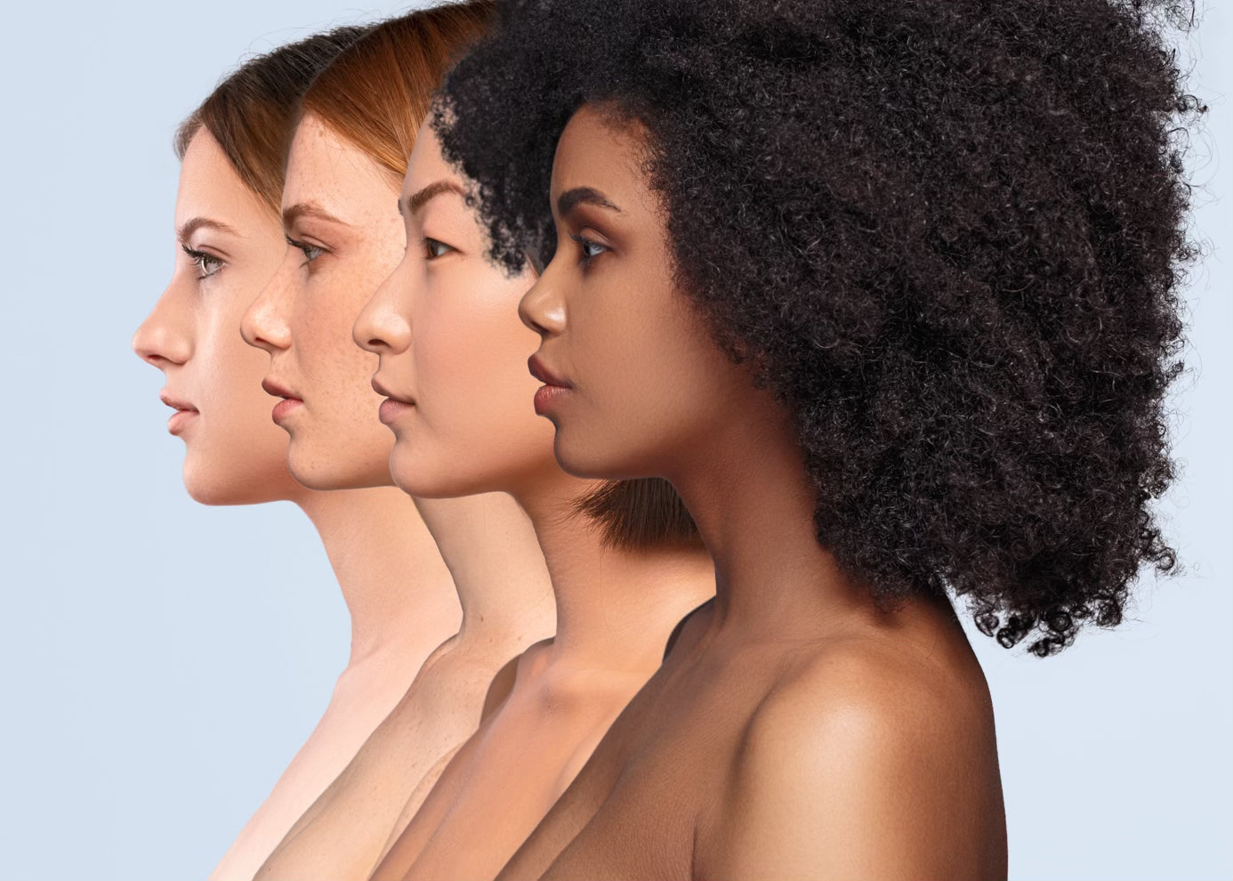 Four multiracial women standing side by side