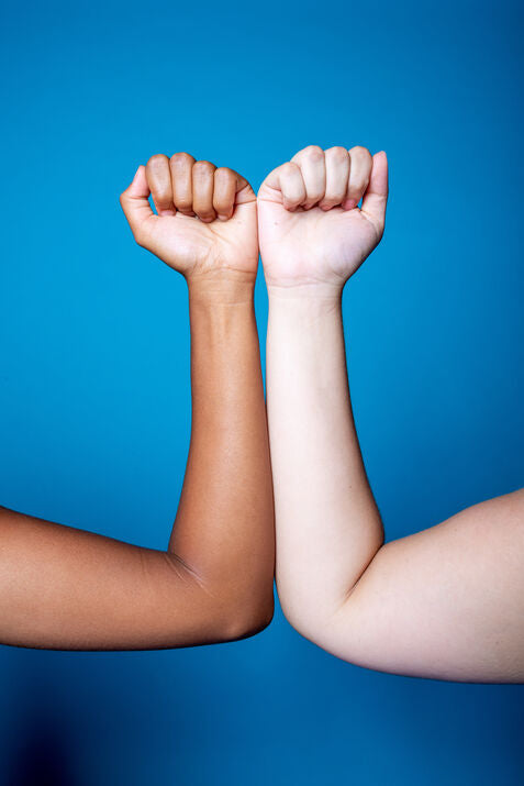 2 different arms with blue background