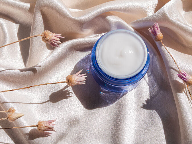 blue bottle with face cream