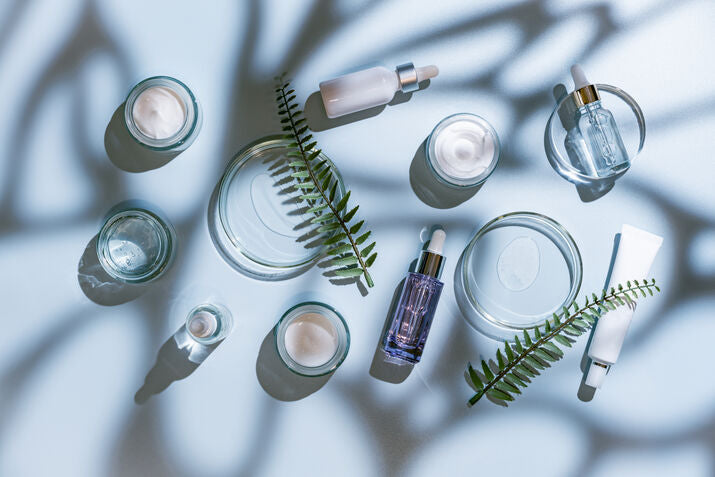 Skincare bottles with blue background