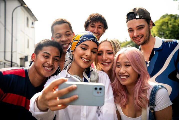 group of you adults taking a selfie