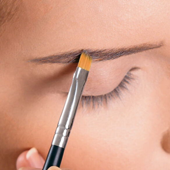 woman tinting her eyebrows