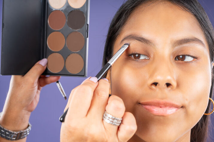 woman getting her make-up done