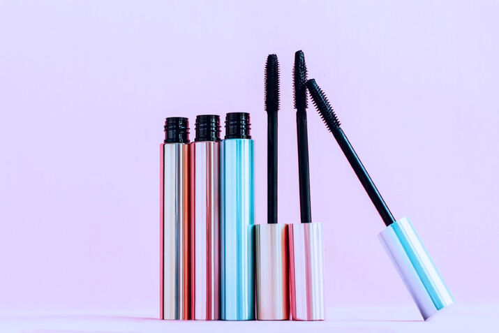 bottles of mascara tubes makeup