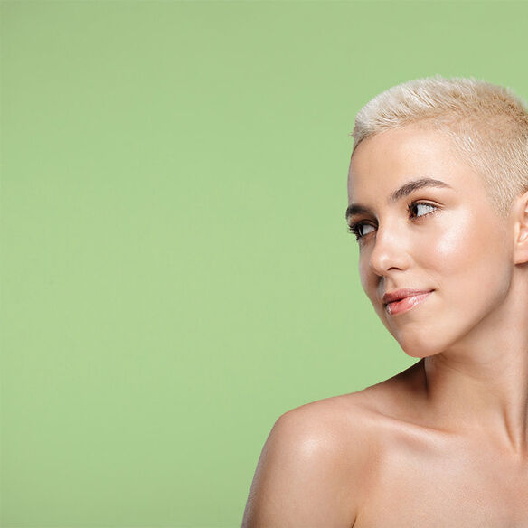 smiling young blonde woman with short hair