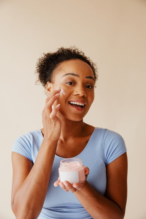 Woman practicing her skincare routine