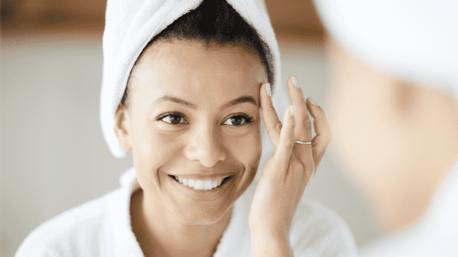 Woman looking at the mirror after shower