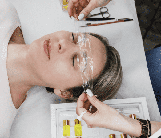 Woman applying plastic wrap 