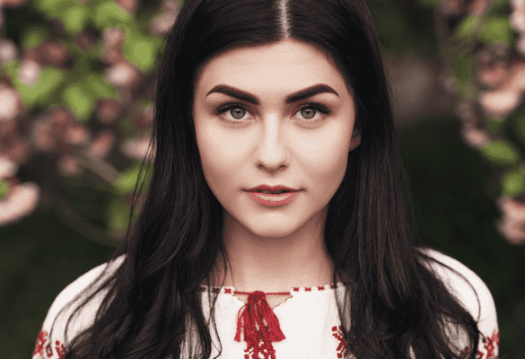 Woman with black hair and blue eyes