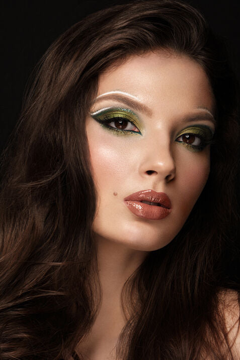 Woman with bold green eyeshadow