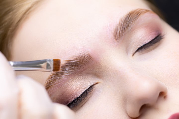 woman getting eyebrow lamination