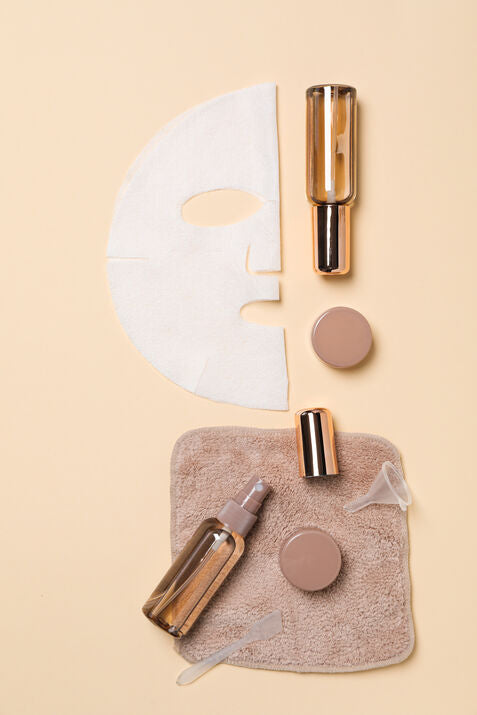 skincare tools and towel with face mask