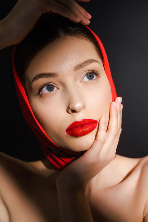 woman with red headscarf and red lip 