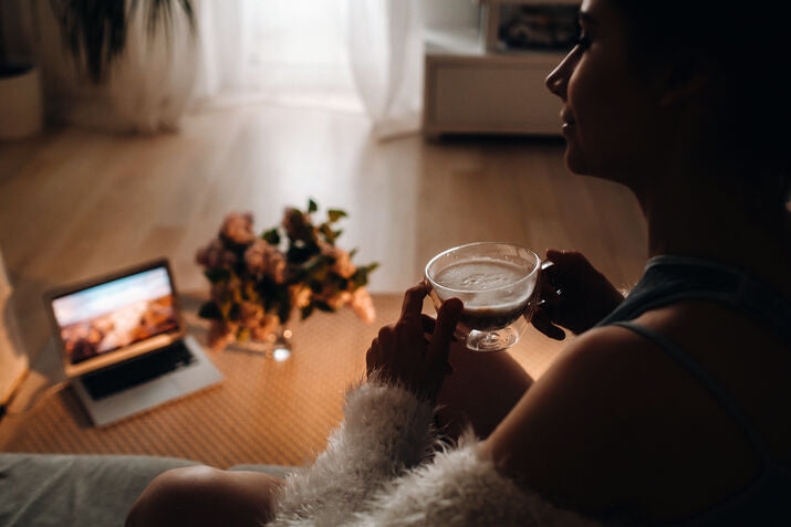 woman drinking coffee and with laptop