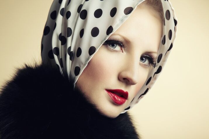 woman with retro make-up and scarf