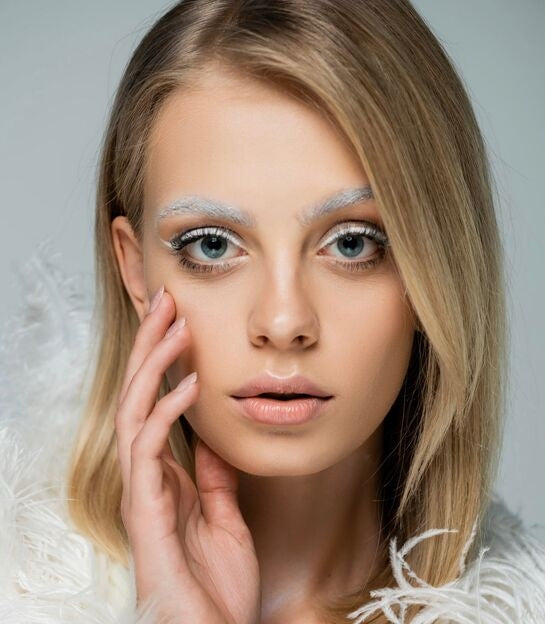 Woman with white clothing and Winter-colored makeup